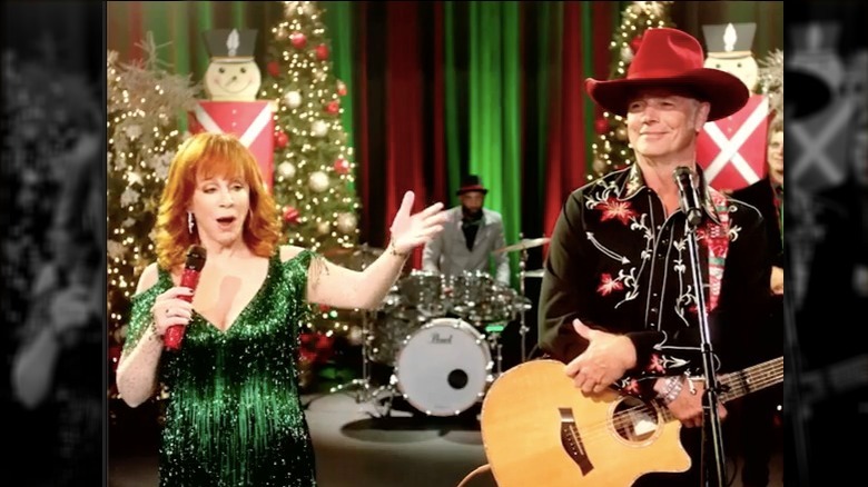 Reba McEntire and John Schneider in "Reba McEntire's Christmas in Tune"