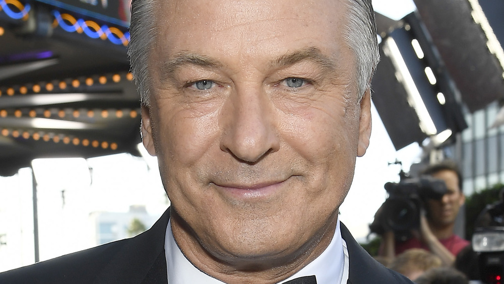 Alec Baldwin smiling on red carpet