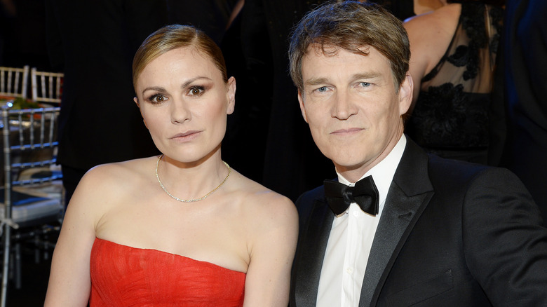 Anna Paquin and Stephen Moyer seated at event with serious expressions