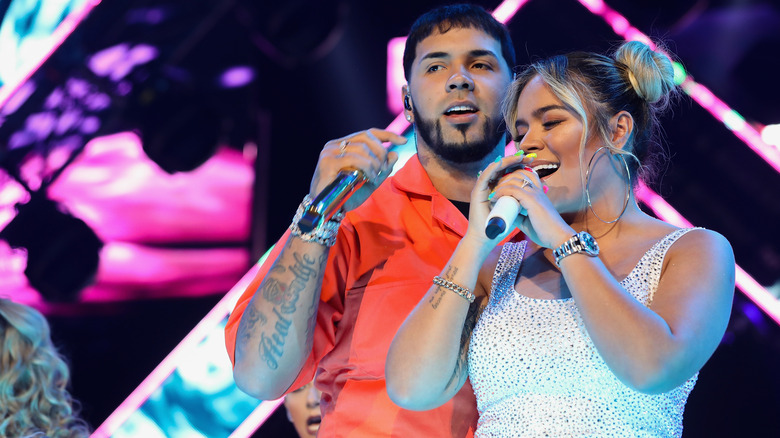 Karol G and Anuel AA performing on stage