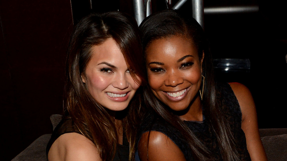 Chrissy Teigen and Gabrielle Union, both smiling