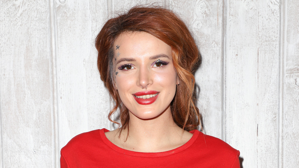 Bella Thorne smiling with red hair