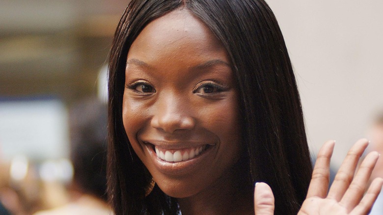 Brandy Norwood smiling and waving