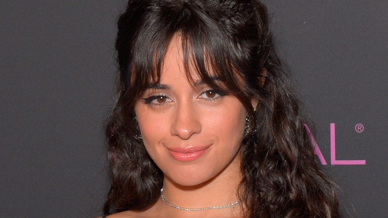 Camila Cabello smiling at an event