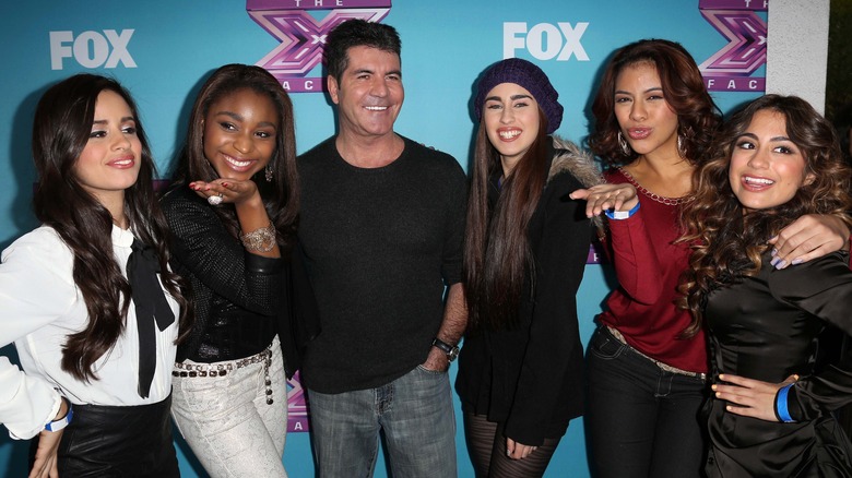 Fifth Harmony with Simon Cowell on the red carpet