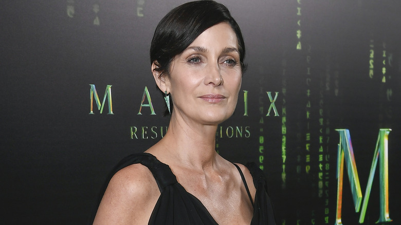 Carrie-Anne Moss posing