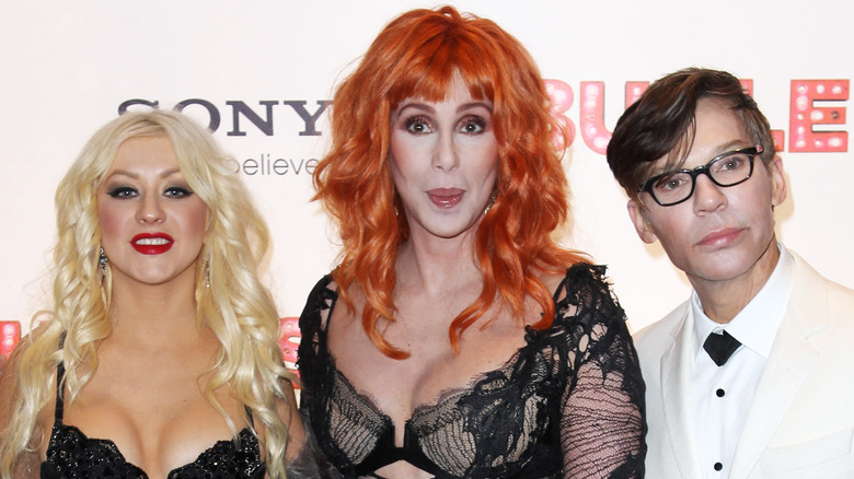 Christina Aguilera, Cher, and Steve Antin on the red carpet