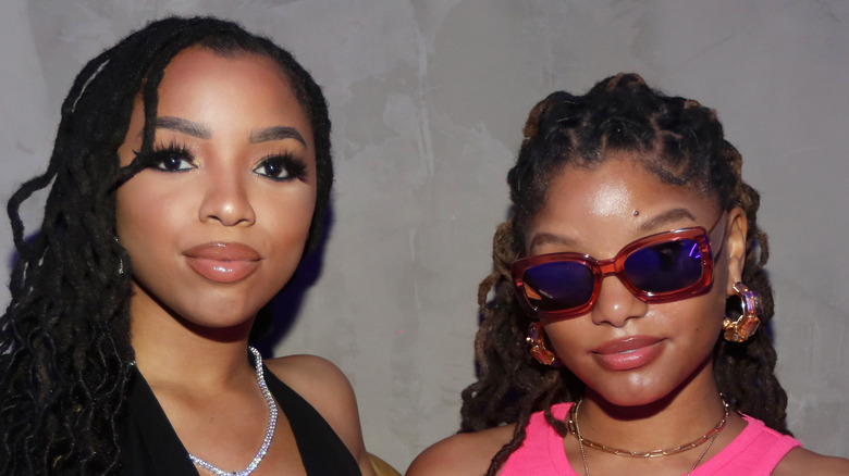 Chloe and Halle Bailey posing for cameras