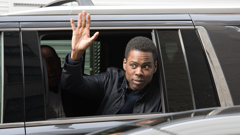 Chris Rock waving from limo