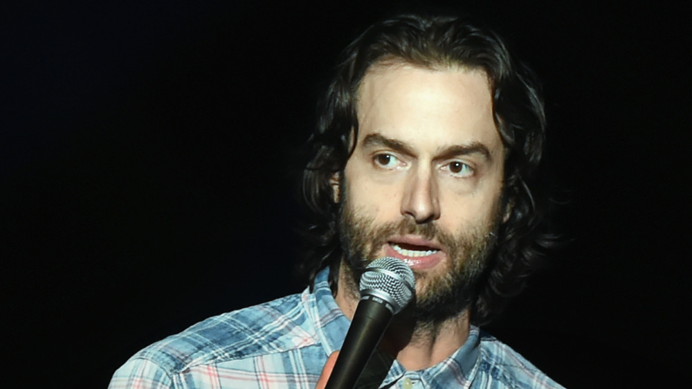 Chris D'Elia holding a mic