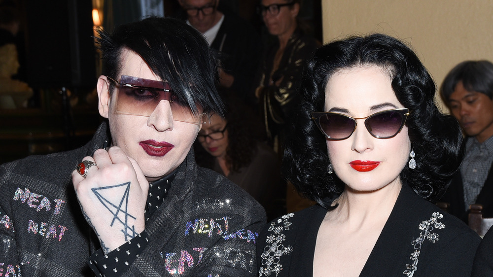 Dita Von Teese and Marilyn Manson posing