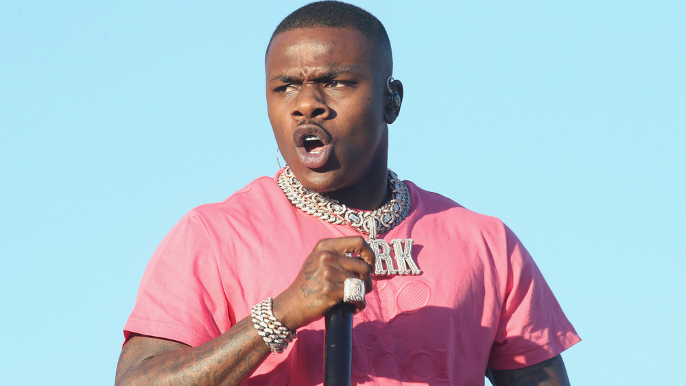 DaBaby rapping into mic outdoors