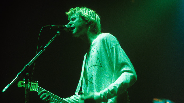 Kurt Cobain performs at concert