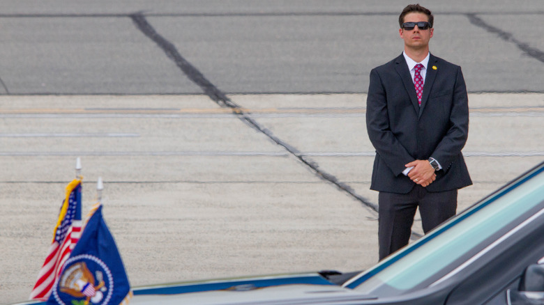 Secret Service agent standing with hands folded