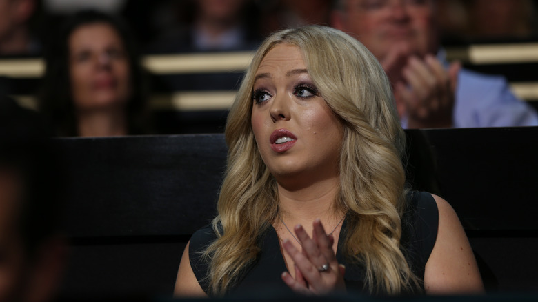 Tiffany Trump, clapping and looking to the side