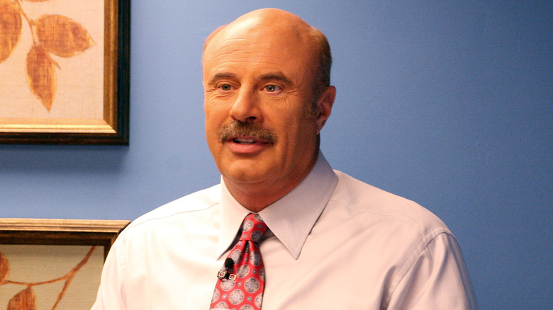 Dr. Phil wearing his hallmark suit and tie