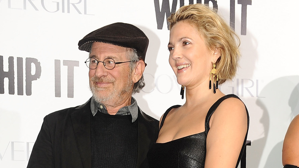 Steven Spielberg and Drew Barrymore posing on red carpet