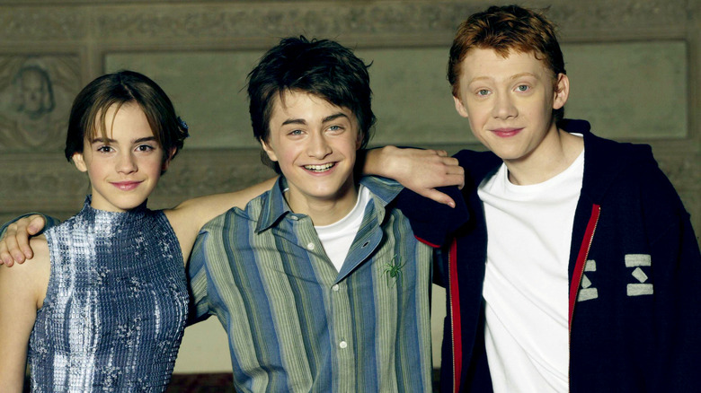 Emma Watson, Daniel Radcliffe, and Rupert Grint pose together in 2002