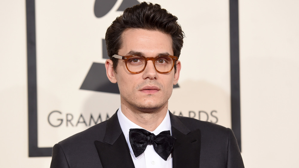 John Mayer in a black tux and glasses at the Grammys