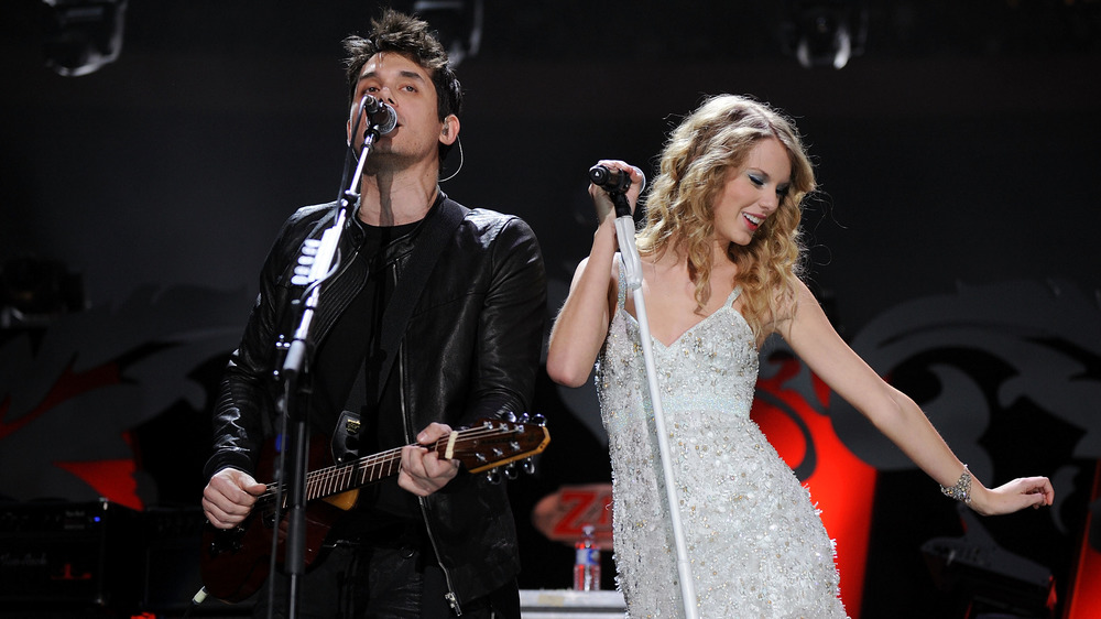 John Mayer playing guitar and singing with Taylor Swift