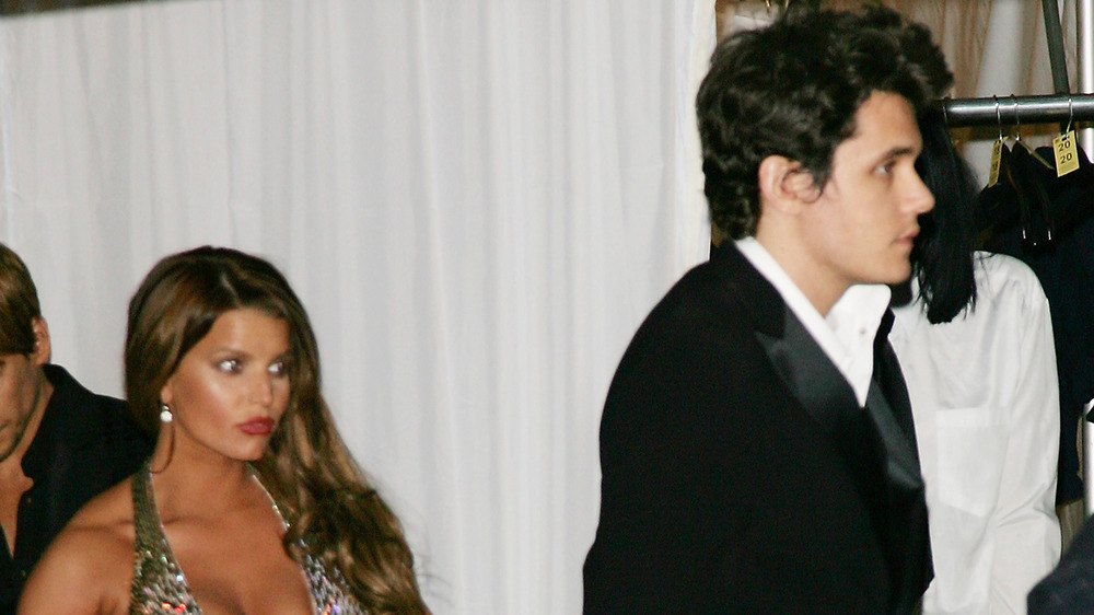 Jessica Simpson looking at John Mayer with a shocked expression