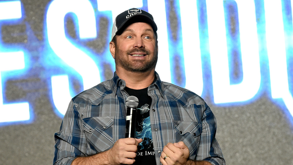 Garth Brooks speaks on stage 