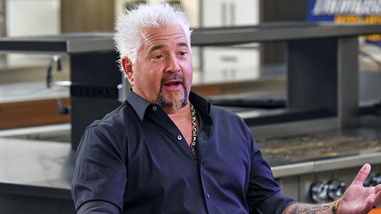 Guy Fieri speaks on screen