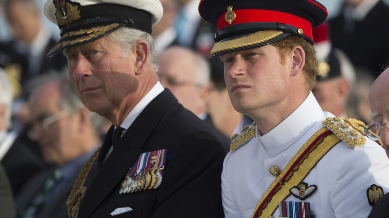 King Charles and Prince Harry wearing uniform