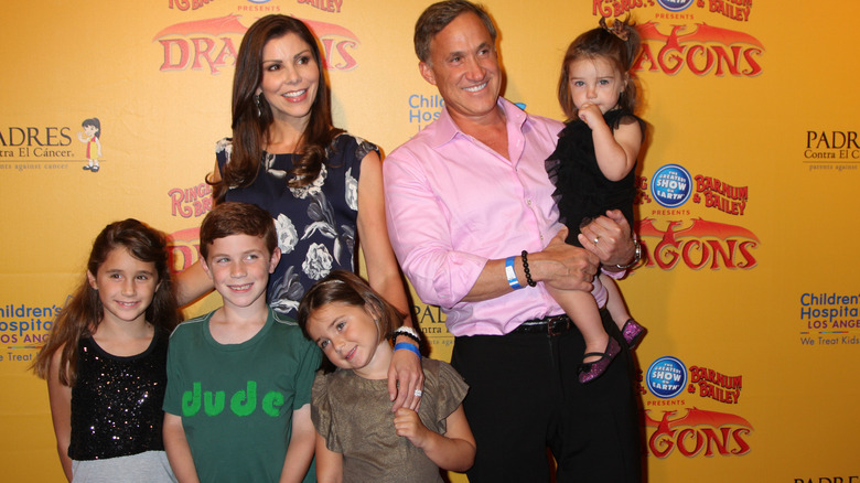 Heather Dubrow poses for a photo with family 