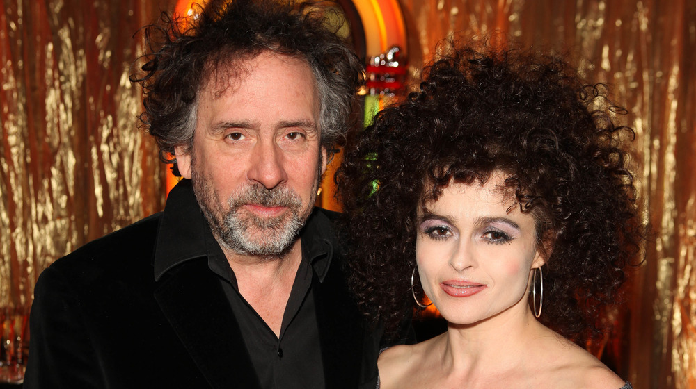 Tim Burton and Helena Bonham Carter posing together at an event