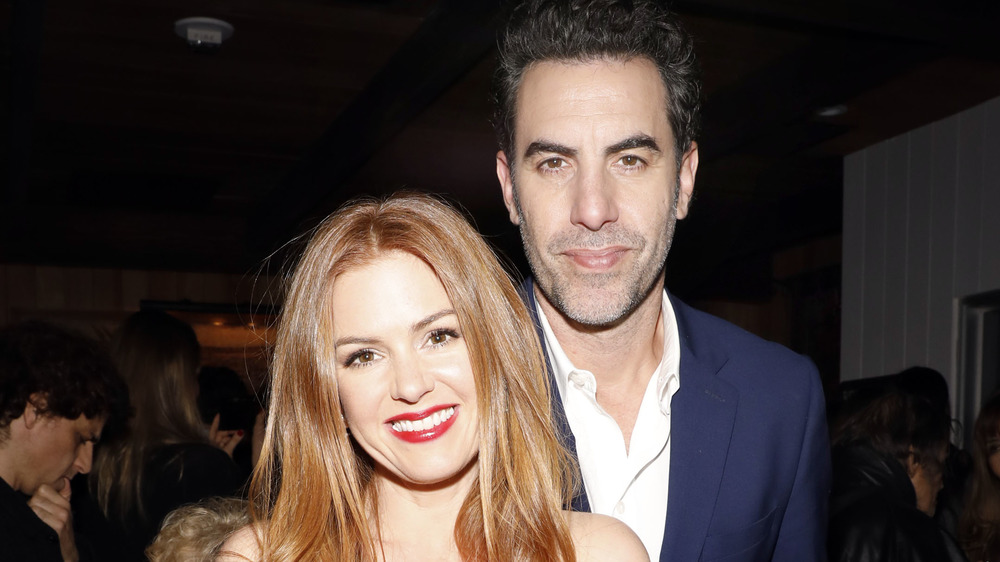 Isla Fisher and Sacha Baron Cohen smiling