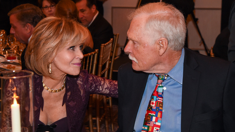 Jane Fonda and Ted Turner looking at each other