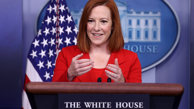 Jen Psaki, smiling, talking with her hands, delivering a press briefing in the white house in April 2021