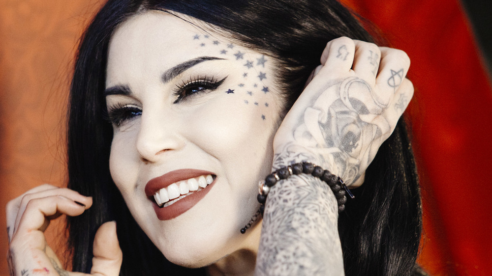 Kat Von D highlighting her tattoos 