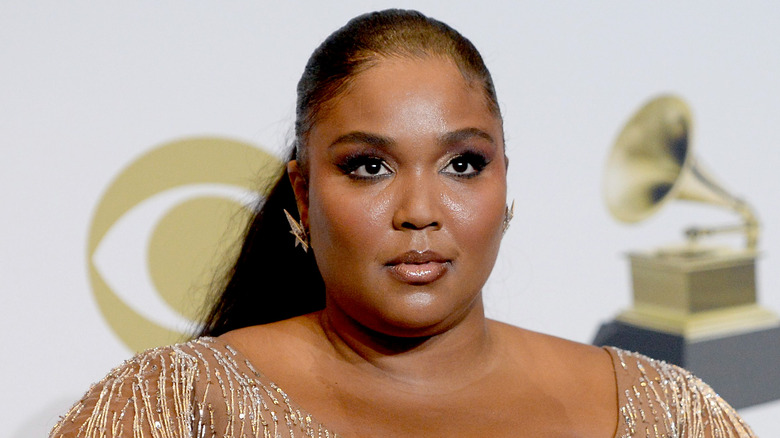 Lizzo with a neutral expression