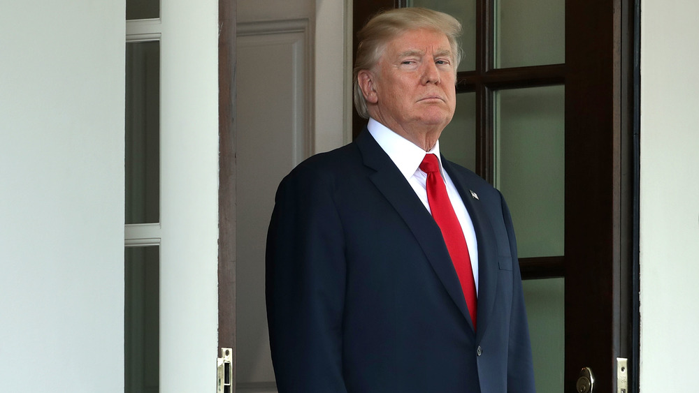 Donald Trump standing in a doorway