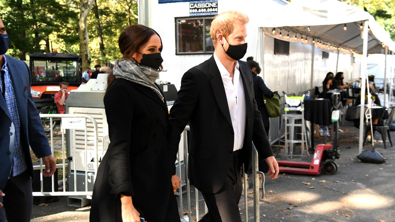 Prince Harry and Meghan Markle in masks