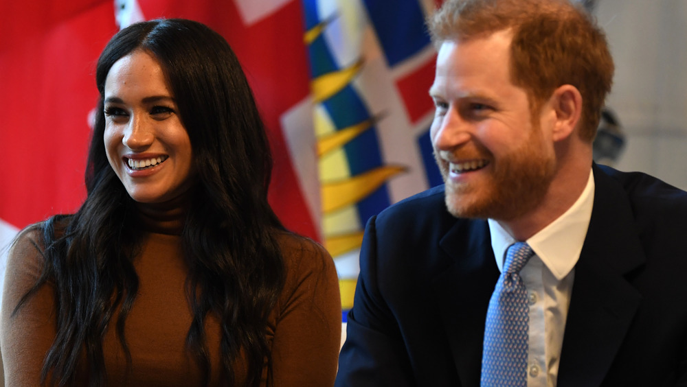 Meghan Markle and Prince Harry sitting down at Canada House in the UK