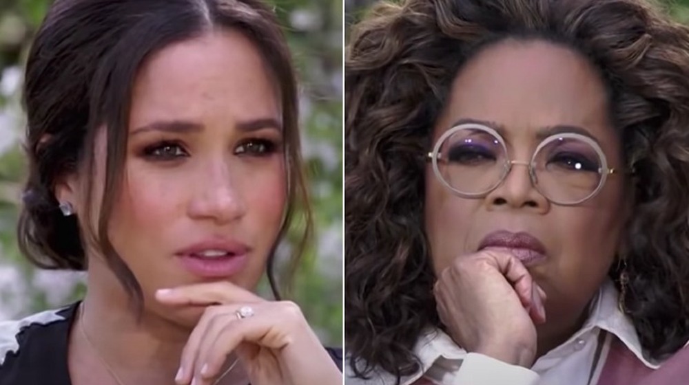 Meghan Markle and Oprah Winfrey with serious expressions