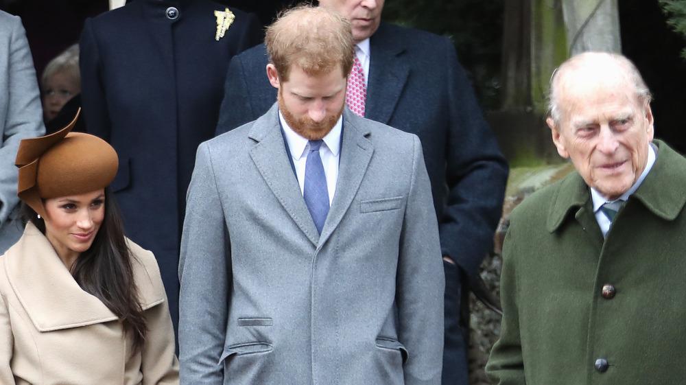 Meghan Markle, Prince Harry, and Prince Philip pose