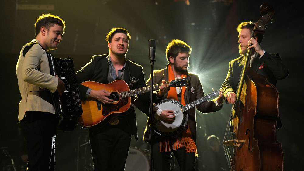 Ben Lovett, Marcus Mumford, 'Country' Winston Marshall and Ted Dwane of Mumford & Sons perform onstage