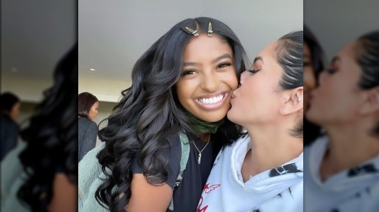 Natalia being kissed by Vanessa Bryant