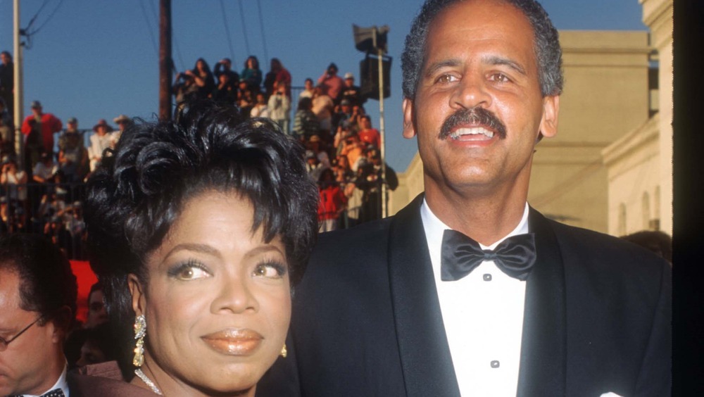 Oprah Winfrey and Stedman Graham looking to the side