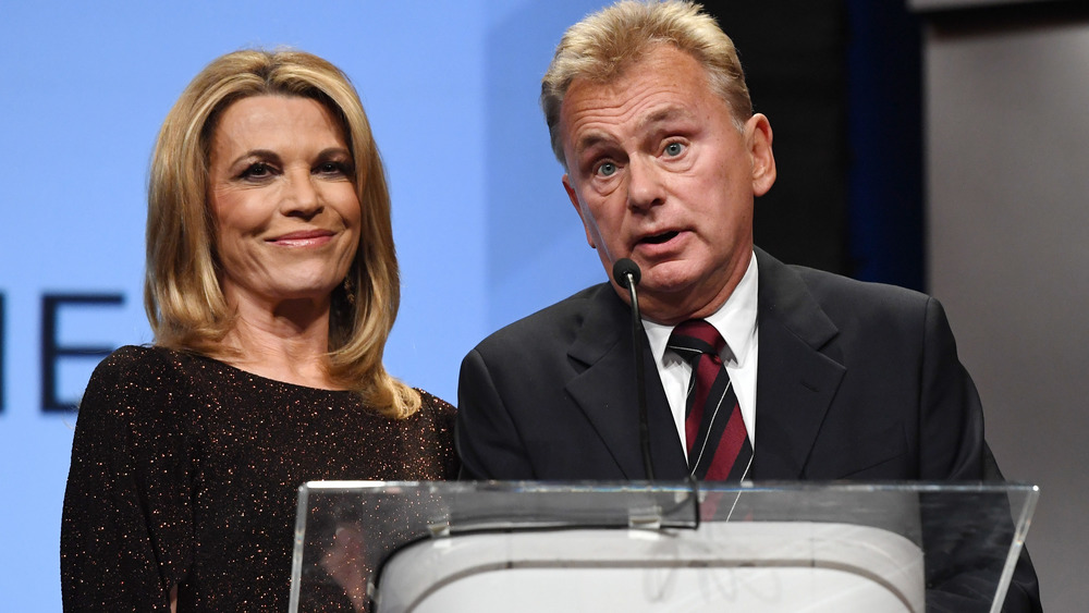 Vanna White and Pat Sajak at podium