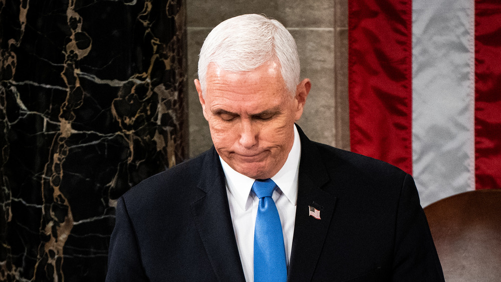 Mike Pence smile-frowning