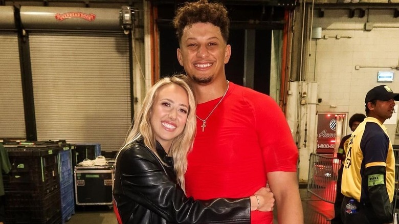 Brittany Mahomes hugging Patrick Mahomes