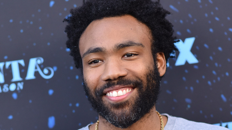 donald glover smiling with short beard