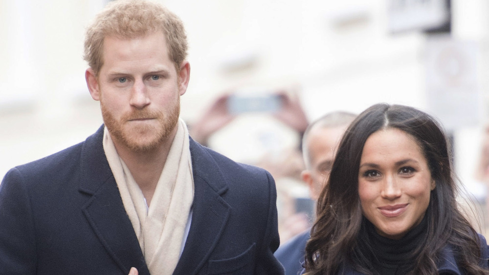 Prince Harry and Meghan Markle walking