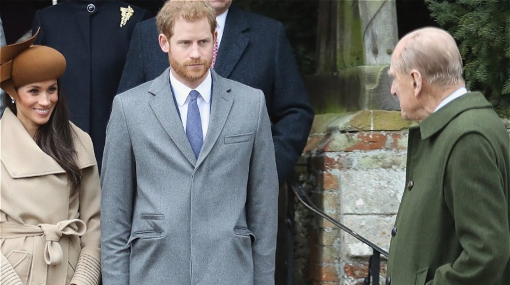 Meghan Markle, Prince Harry, and Prince Philip, all standing together