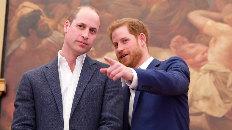 Prince William and Prince Harry talking in 2018.